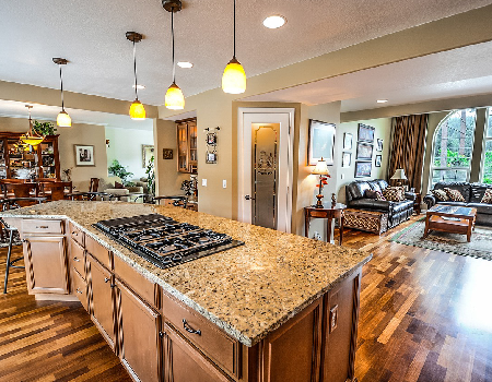 Kitchen island with pendant lighting and hidden storage Utica